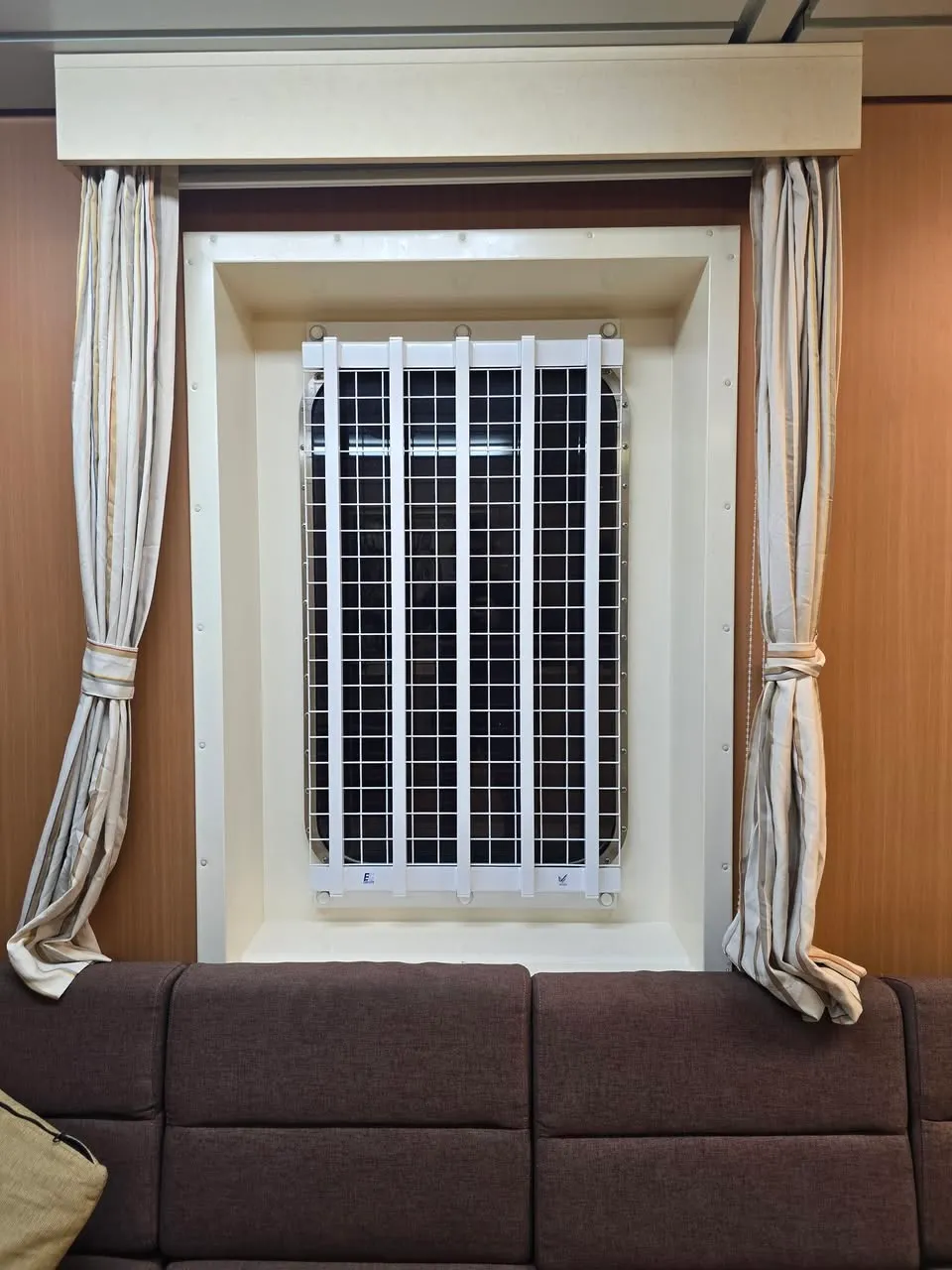 Easi-Grille installed on ship porthole — close-up